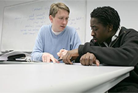 student working with a tutor