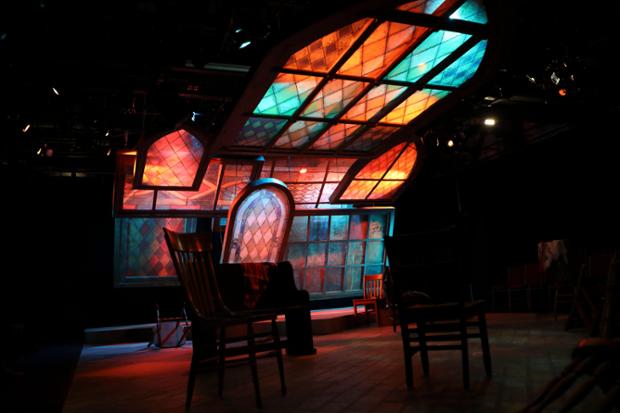 theater stage set with stained glass background