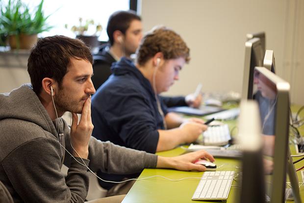 students wearing headsets at computers