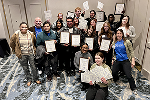 group of students showing their award certificates